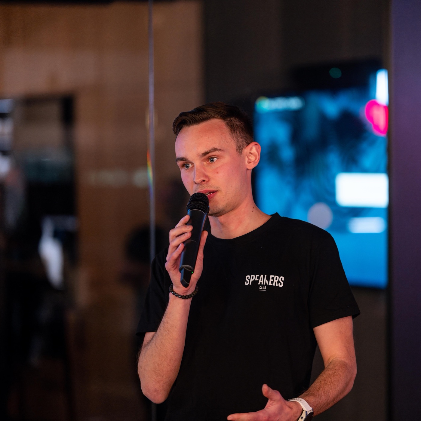 Tomáš Pařízek speaking at an event